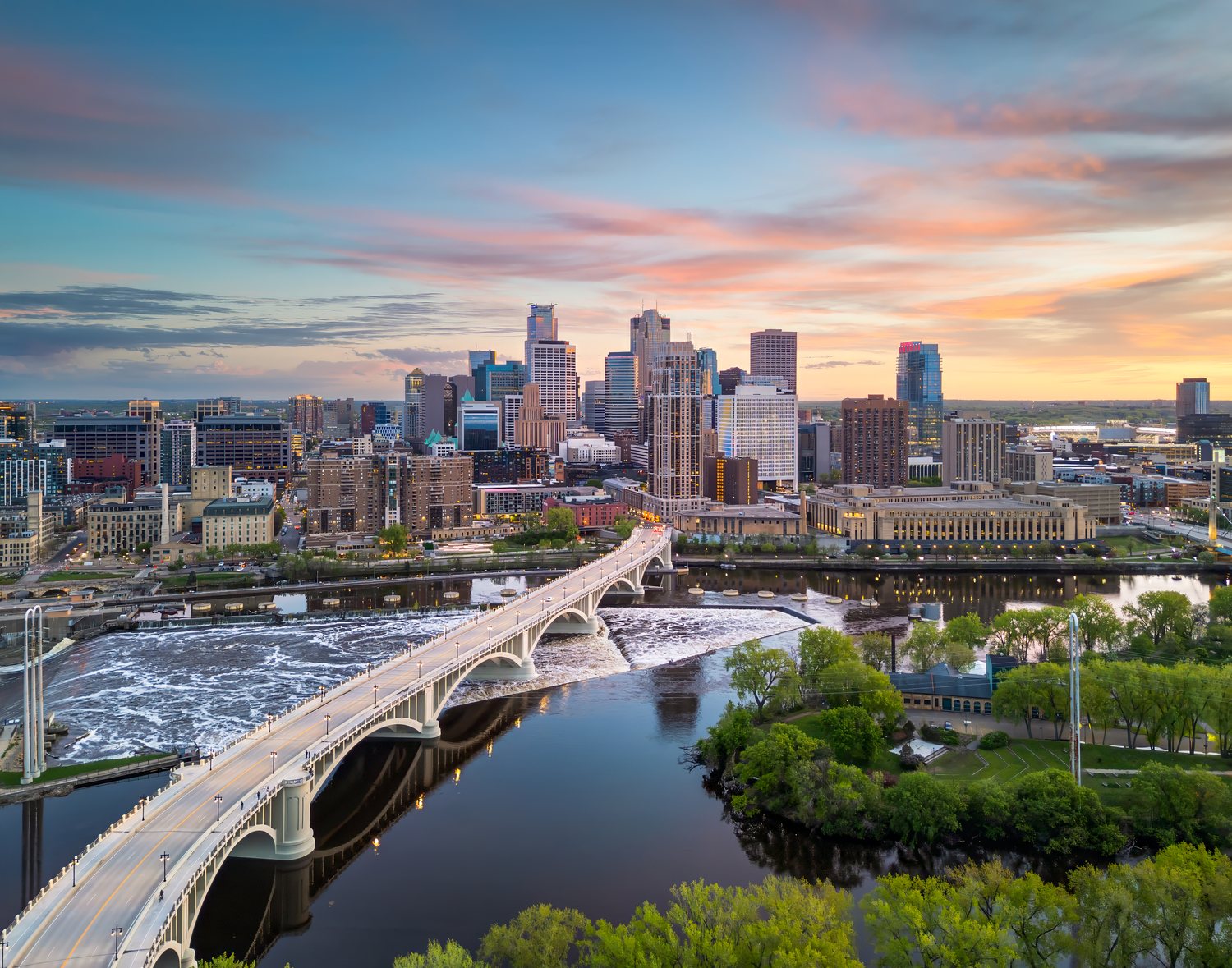 Minneapolis skyline at dusk over the Mississippi River